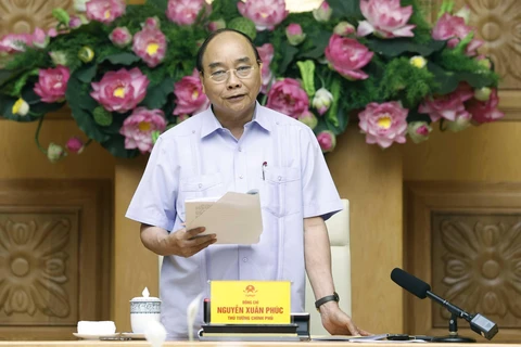 Thủ tướng Nguyễn Xuân Phúc chủ trì họp Ban Chỉ đạo cơ cấu lại hệ thống các tổ chức tín dụng. (Ảnh: Thống Nhất/TTXVN)