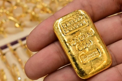 Giá vàng thế giới tăng gần 1% trong phiên giao dịch ngày 14/7