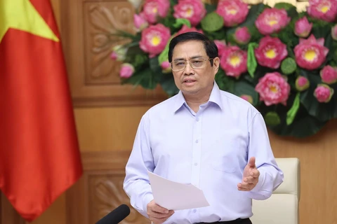 Thủ tướng Phạm Minh Chính nhấn mạnh, Chính phủ luôn đồng hành cùng doanh nghiệp, đảm bảo "lợi ích hài hòa, rủi ro chia sẻ." (Ảnh: Dương Giang-TTXVN)