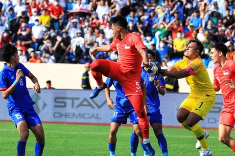 U23 Lào (áo xanh) đánh rơi chiến thắng dù dẫn trước 2-0 đến phút 88. (Ảnh: Tuấn Anh/TTXVN)