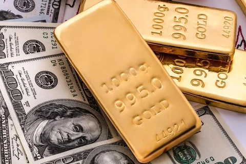 Đà giảm của đồng USD hỗ trợ giá vàng thế giới trong phiên 24/4