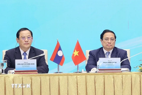 Thủ tướng Phạm Minh Chính và Thủ tướng Lào Sonexay Siphandone dự Hội nghị hợp tác đầu tư Việt Nam-Lào 2024. (Ảnh: Dương Giang/TTXVN)
