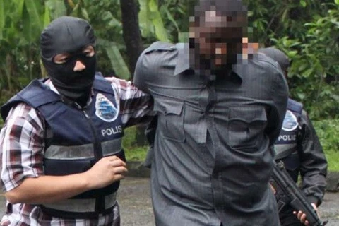 Cảnh sát Malaysia bắt giữ một nghi phạm khủng bố. Ảnh minh họa. (Nguồn: The Star)