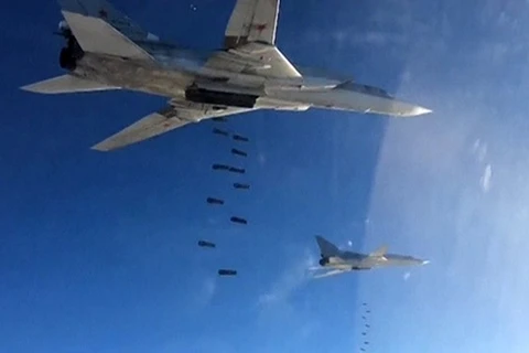 Máy bay Nga thả bom xuống Syria (Nguồn: RT)