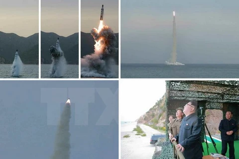 Nhà lãnh đạo Kim Jon-un theo dõi vụ phóng tên lửa từ tàu ngầm. (Nguồn: Yonhap/TTXVN)