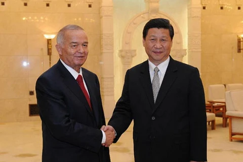 Chủ tịch Trung Quốc Tập Cận Bình và Tổng thống Uzbekistan Islam Karimov. (Nguồn: News.cn)