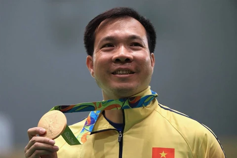 Ngày 6/8/2016: Xạ thủ Hoàng Xuân Vinh giành tấm HCV đầu tiên và phá kỷ lục Olympic nội dung 10m súng ngắn hơi nam tại Olympic Rio với thành tích 202,5 điểm. (Nguồn: TTXVN)