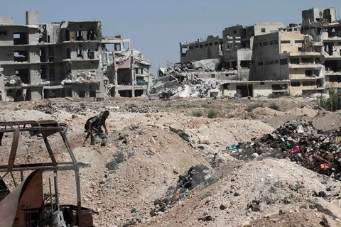 Nhà cửa bị phá hủy tại thành phố Aleppo, miền bắc Syria ngày 12/9. (Nguồn: THX/TTXVN)