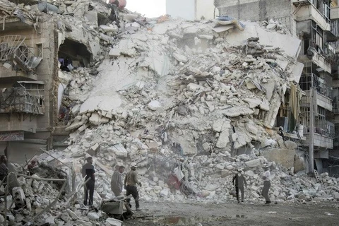 Cảnh đổ nát do xung đột ở Qatarji, ngoại ô thành phố Aleppo ngày 17/10. (Nguồn: AFP/TTXVN)