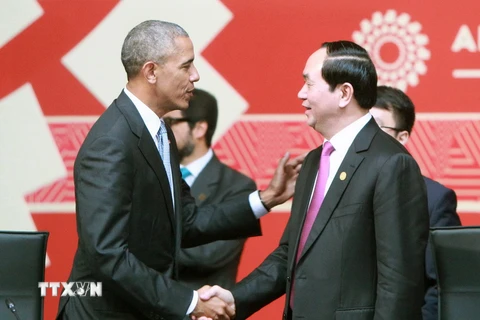 Chủ tịch nước Trần Đại Quang với Tổng thống Mỹ Barack Obama tại phiên khai mạc. (Ảnh: Nhan Sáng/TTXVN)