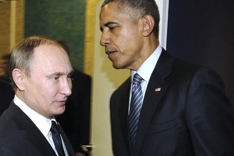 Tổng thống Nga Vladimir Putin (trái) và người đồng cấp Mỹ Barack Obama trong một cuộc gặp. (Nguồn: RT)