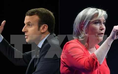 Ứng cử viên Emmanuel Macron (trái) và ứng cử viên Marine Le Pen (phải). (Nguồn: AFP/TTXVN)