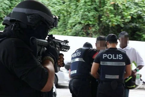 Lực lượng cảnh sát Malaysia làm nhiệm vụ. (Nguồn: Straits Times)
