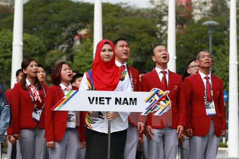 Đoàn Thể thao Việt Nam tại buổi lễ thượng cờ. (Ảnh: Quốc Khánh/TTXVN)