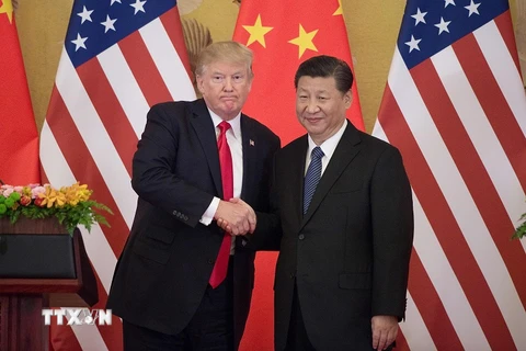 Tổng thống Mỹ Donald Trump (trái) và Chủ tịch Trung Quốc Tập Cận Bình. (Nguồn: AFP/TTXVN)