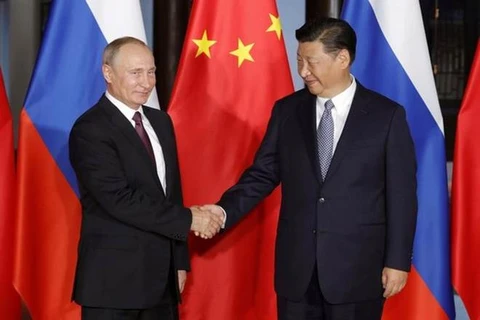 Tổng thống Nga Vladimir Putin (trái) và Chủ tịch Trung Quốc Tập Cận Bình. (Nguồn: AIN)