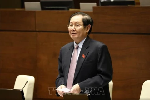 Bộ trưởng Bộ Nội vụ Lê Vĩnh Tân trả lời chất vấn các câu hỏi của đại biểu Quốc hội. (Nguồn ảnh: TTXVN) 