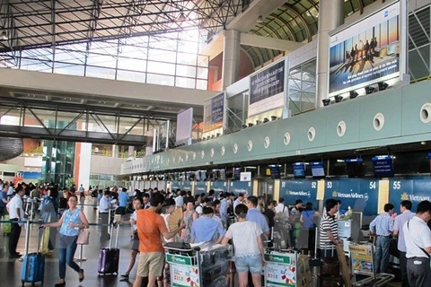 Hành khách sẽ có tiếng nói quyết định đến chất lượng dịch vụ tại sân bay Tân Sơn Nhất. (Ảnh: Việt Hùng/Vietnam+)