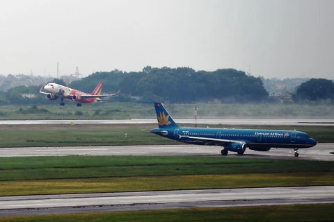 Máy bay của hai hãng hàng không Vietnam Airlines và Vietjet Air. (Ảnh: CTV/Vietnam+)