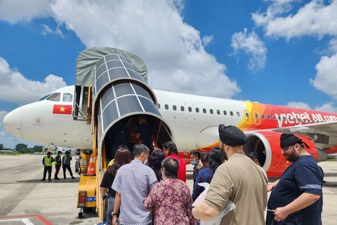 Hành khách đi máy bay của hãng hàng không Vietjet Air. (Ảnh: CTV/Vietnam+)