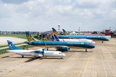 Máy bay của các hãng hàng không Vietnam Airlines, Pacific Airlines và VASCO tại sân bay Nội Bài. (Ảnh: CTV/Vietnam+)