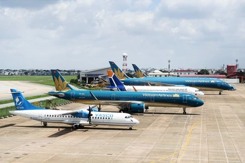 Máy bay của 3 Hãng hàng không Vietnam Airlines, Pacific Airlines và VASCO tại sân bay Nội Bài. (Ảnh: CTV/Vietnam+)