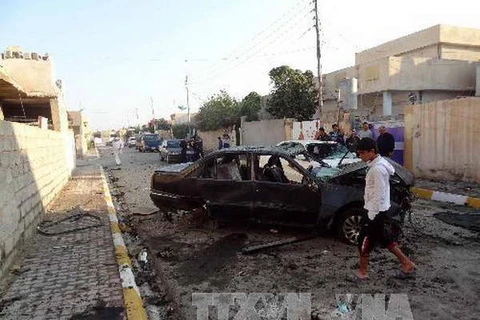 Hiện trường một vụ đánh bom xe tại Sadr City, phía đông bắc thủ đô Baghdad. (Nguồn: AFP/TTXVN)