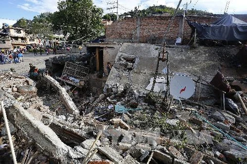 Hiện trường một vụ đánh bom tình nghi do FARC thực hiện tại thị trấn Inza ngày 8/12. (Nguồn: AFP/TTXVN) 