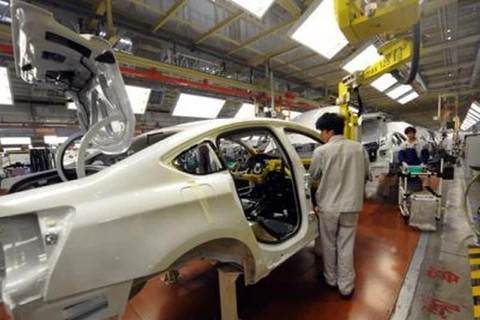 Trung Quốc giảm tốc tăng trưởng công nghiệp trong tháng 11