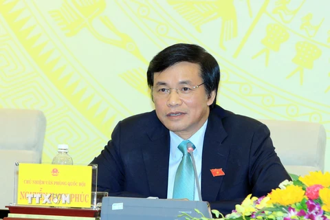 Chủ nhiệm Văn phòng Quốc hội Nguyễn Hạnh Phúc trả lời báo chí tại cuộc họp. (Ảnh: An Đăng/TTXVN)