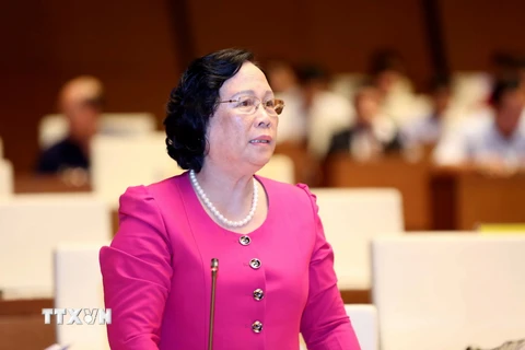 Bộ trưởng Bộ Lao động, Thương binh và Xã hội Phạm Thị Hải Chuyền trả lời chất vấn. (Ảnh: Phương Hoa/TTXVN)