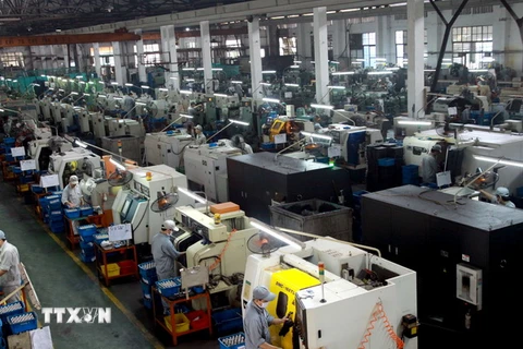 Sản xuất linh kiện xe máy tại Khu công nghiệp Sông Công, Thái Nguyên. (Nguồn: TTXVN)
