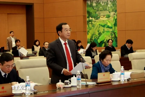 Chủ nhiệm Văn phòng Chủ tịch nước Đào Việt Trung đọc dự thảo Báo cáo công tác. (Ảnh: Phương Hoa/TTXVN)