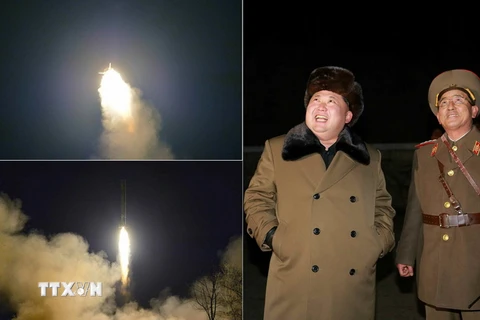 Nhà lãnh đạo Triều Tiên Kim Jong-un (trái) thị sát vụ phóng thử tên lửa đạn đạo tầm ngắn trong một cuộc diễn tập quân sự. (Nguồn: YONHAP/TTXVN)