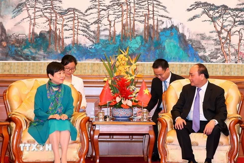 Thủ tướng Nguyễn Xuân Phúc tiếp Chủ tịch Hội hữu nghị đối ngoại nhân dân Trung Quốc Lý Tiểu Lâm. (Ảnh: Thống Nhất/TTXVN)