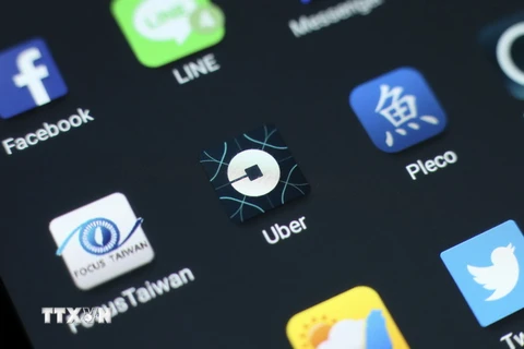 Biểu tượng của tập đoàn Uber trên màn hình điện thoại . (Nguồn: EPA/TTXVN)