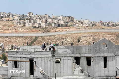 Công trường xây dựng khu định cư ở thành phố Bờ Tây Ramallah ngày 19/4. (Nguồn: EPA/TTXVN)