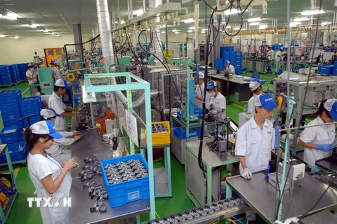  Dây chuyền sản xuất linh kiện ôtô, xe máy tại nhà máy của Công ty TNHH Keihin Việt Nam. (Ảnh: Danh Lam/TTXVN)
