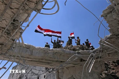 Các lực lượng ủng hộ Chính phủ Syria làm nhiệm vụ tại Quneitra ngày 19/7/2018. (Ảnh: AFP/TTXVN)