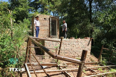Công trình xây dựng trong rừng phòng hộ thuộc thôn Lâm Trường xã Minh Phú (Sóc Sơn, Hà Nội) đã được người dân tự giác tháo dỡ phần vi phạm. (Ảnh: Mạnh Khánh/TTXVN)