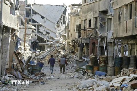 Cảnh tàn phá sau các cuộc xung đột ở Damascus, Syria ngày 3/11. (Ảnh: AFP/TTXVN)