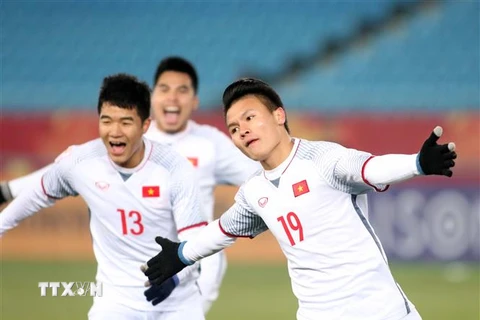 Tuyển U23 Việt Nam trong trang phục trắng đã lập nên kỳ tích khi đánh bại U23 Qatar ở Vòng chung kết U23 châu Á. (Ảnh: Nguyên Vũ-Huy Anh/TTXVN)