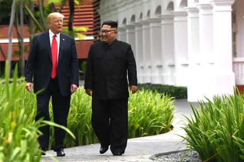 Tổng thống Mỹ Donald Trump (trái) và nhà lãnh đạo Triều Tiên Kim Jong-un. (Ảnh: AFP/TTXVN)