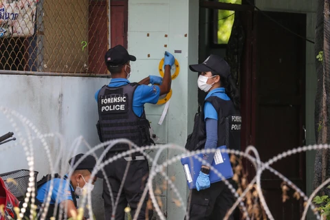 Cảnh sát điều tra tại hiện trường một vụ tấn công ở Pattani, miền nam Thái Lan, ngày 24/7/2019. (Ảnh: AFP/TTXVN)