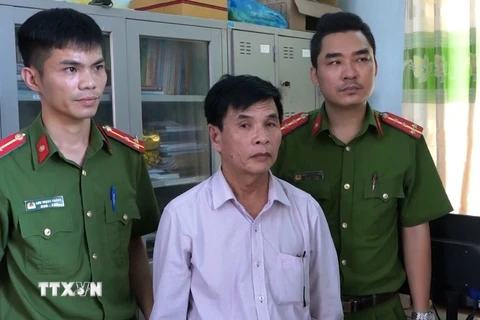 Đối tượng Dương Minh Hiến bị bắt giữ. (Ảnh: Võ Dung/TTXVN)