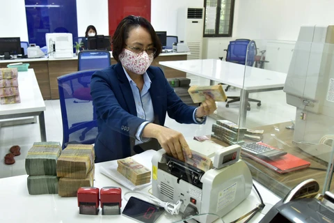 Hoạt động nghiệp vụ tại VietinBank chi nhánh Hai Bà Trưng, Hà Nội. (Ảnh: Trần Việt/TTXVN)
