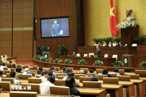 Đại tướng Tô Lâm, Bộ trưởng Bộ Công an giải trình ý kiến của đại biểu Quốc hội nêu. (Ảnh: Văn Điệp/TTXVN)