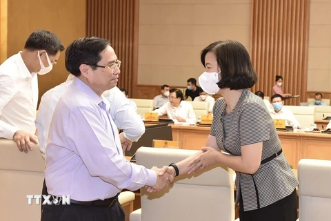 Thủ tướng Phạm Minh Chính và bà Vũ Việt Trang, Phó Tổng Giám đốc TTXVN. (Ảnh: Dương Giang/TTXVN)