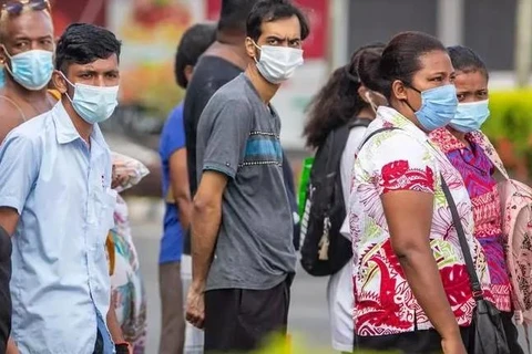 Người dân Fiji đeo khẩu trang phòng chống COVID-19. (Nguồn: AFP)