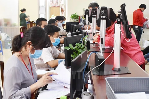Giải quyết hồ sơ thủ tục hành chính cho người dân, doanh nghiệp tại Sở Tư pháp TP Hồ Chí Minh. (Nguồn: hcmcpv.org.vn)